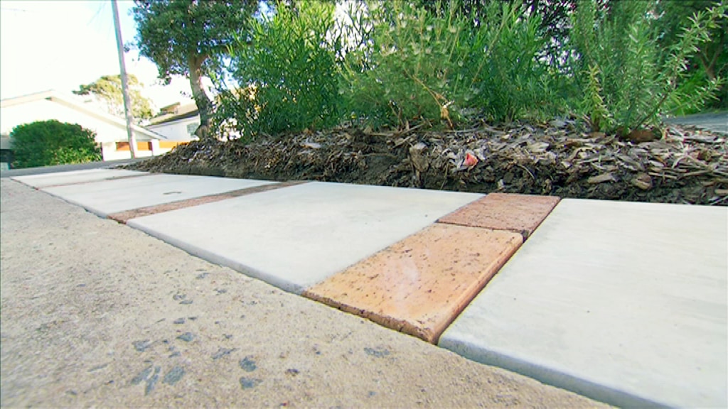 Pavers along the edge of a garden.