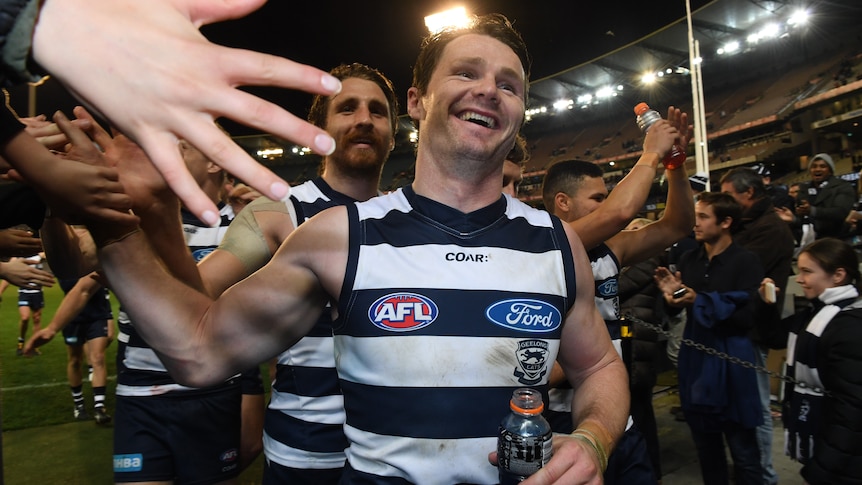 Patrick Dangerfield celebrates with fans after win over Swans