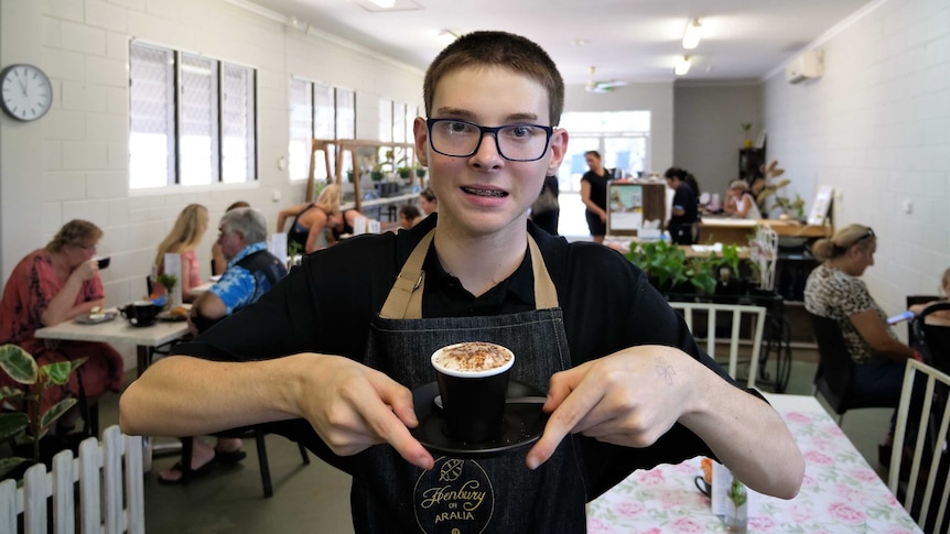 Henbury School student Carter Barnett working at the at Henbury on Aralia cafe in Nightcliff