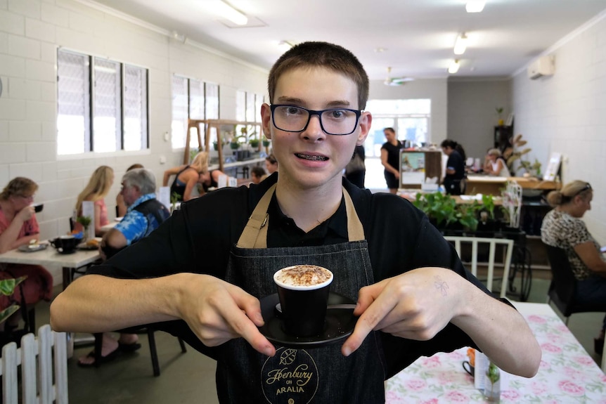 Henbury School student Carter Barnett working at the at Henbury on Aralia cafe in Nightcliff