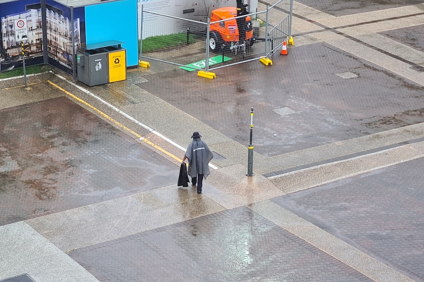 A man in rain in Brisbane