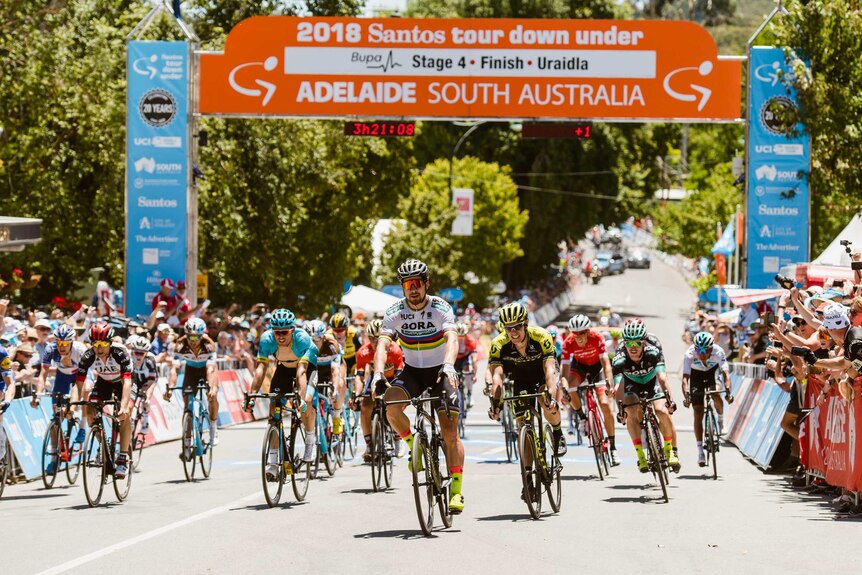 Peter Sagan crosses the finish line ahead other riders at Uraidla.