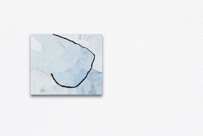 a blue painting on a white gallery wall