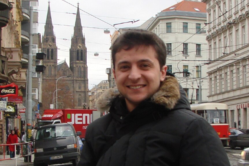 A very young and smiley Volodymyr Zelenskky in a puffy, fur trimmed jacket