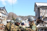 'Appalling circumstances': Japanese soldiers survey the damage near Miyako port