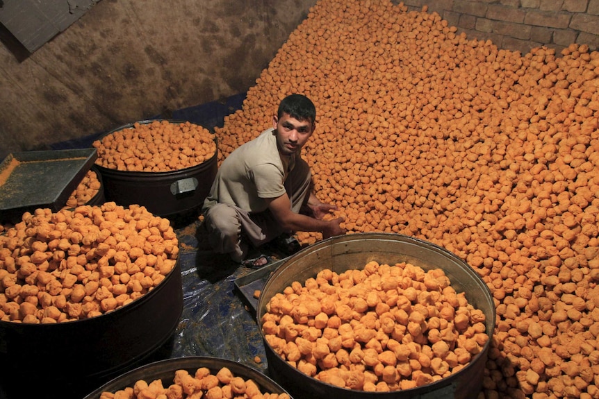 A vendor prepares special sweet for Eid al-Fitr