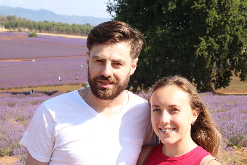 Tetyana Veliazhanina and Ivan Kjokjorovski stand in front of lavender fields in Tasmania.