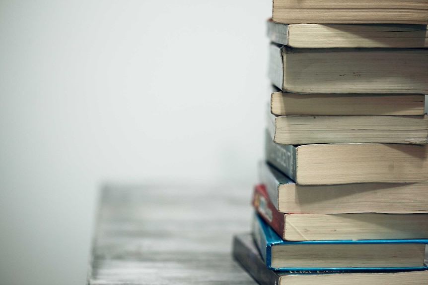 old books piled on top of each other