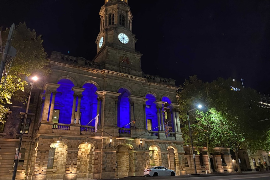 The first floor balcony of Adelaide Town Hall lit with blue light in tribute to SA Police Chief Superintendent Joanne Shanahan