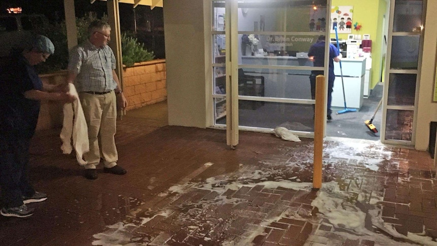 Staff clean up minor flood damage