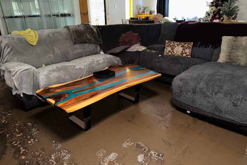 A lounge room covered in mud