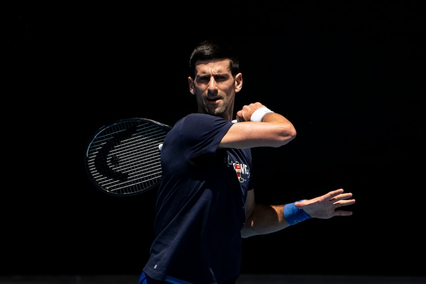 Novak Djokovic plays a forehand