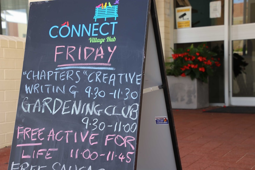 A blackboard with a list of daily activities written on it with different colours of chalk