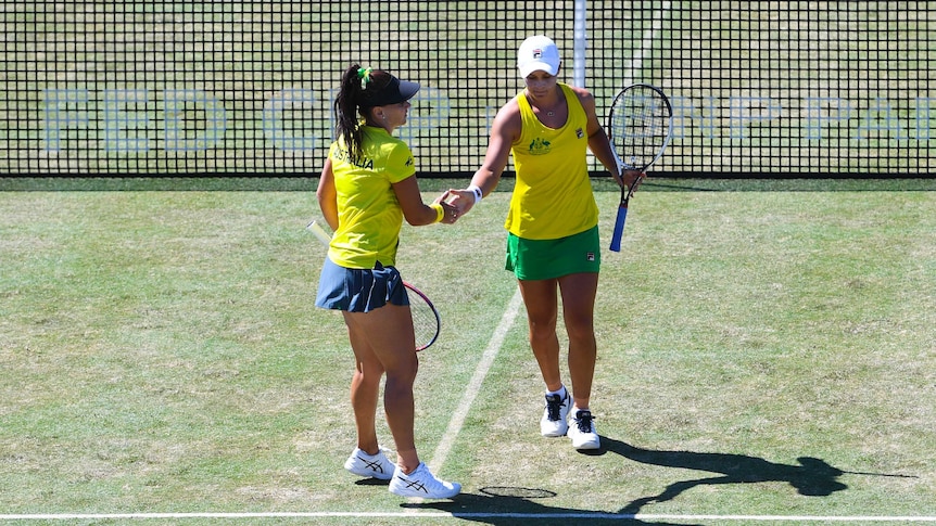 Australia's Casey Dellacqua (L) and Ashleigh Barty during a Fed Cup doubles match against Ukraine.