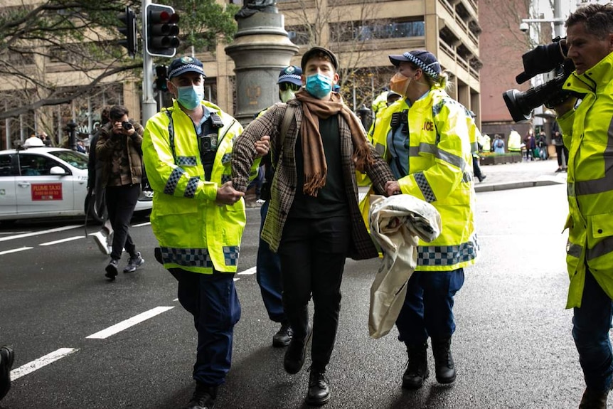 A man is taken away by police