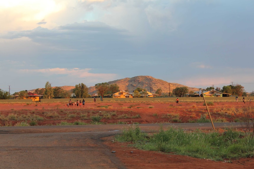 View of landscape with small figures walking away