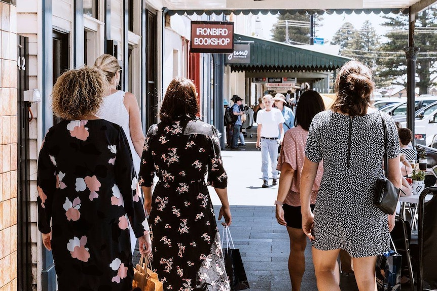 Women walking down a street