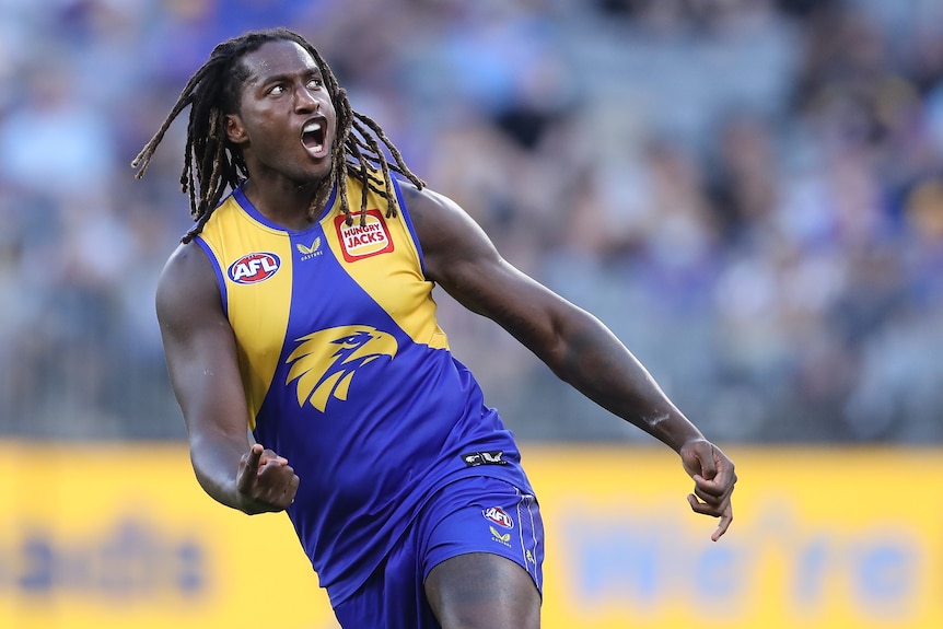 West Coast Eagles AFL player Nic Naitanui shouts as he runs after kicking a goal against Fremantle Dockers.