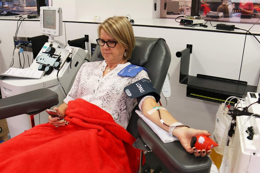 Stacey Cornford donates blood at the Brisbane Blood Donor Centre of the Australian Red Cross Blood Service in April 2017