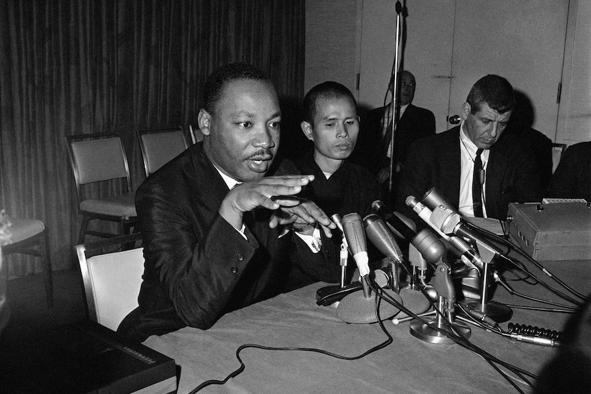 Dr Martin Luther King Jr appears at a news conference with Thich Nhat Hanh