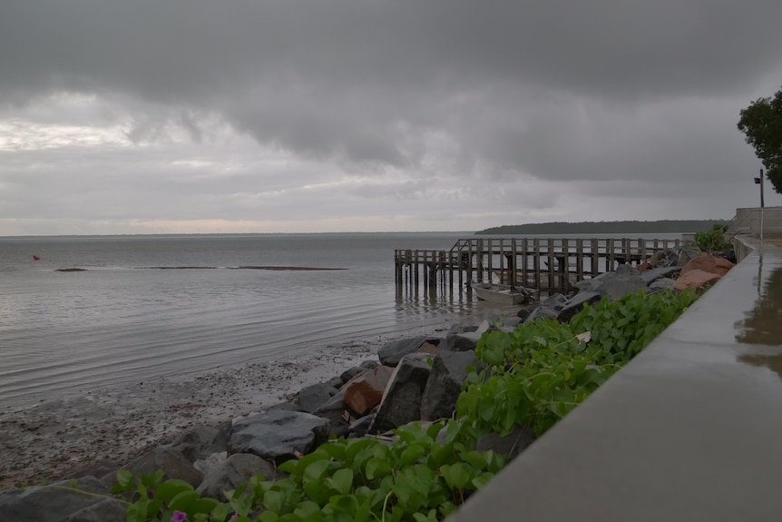 Cloudy image of the Boigu seawall and Jetty over the ocean 