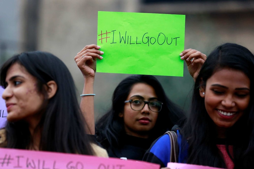 Women prepare to march in New Delhi, India.