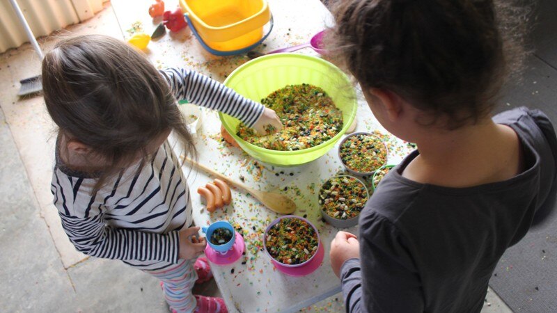 Children play with cooking toys at a toy library run by the Outback Mobile Resource Unit in far west New South Wales.