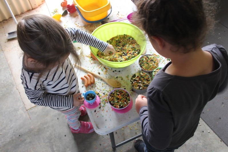Children play with cooking toys at a toy library run by the Outback Mobile Resource Unit in far west New South Wales.