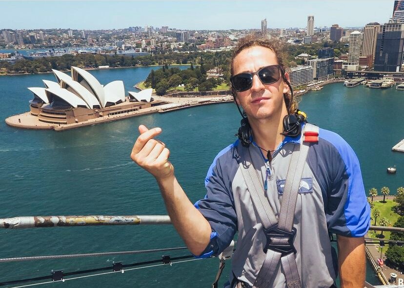 A man climbing the Sydney Harbour Bridge.
