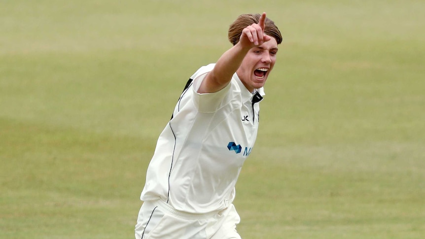 Cameron Green celebrates after bowling.