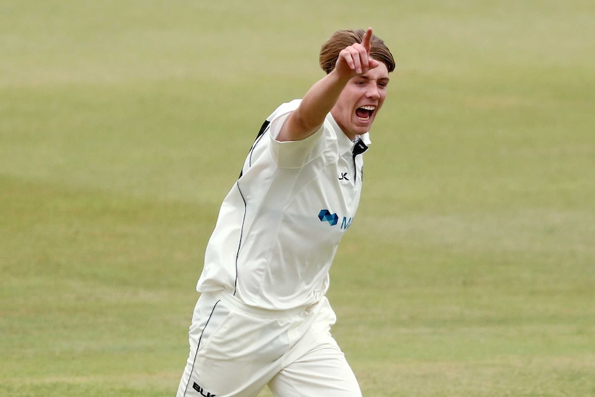 Cameron Green celebrates after bowling.