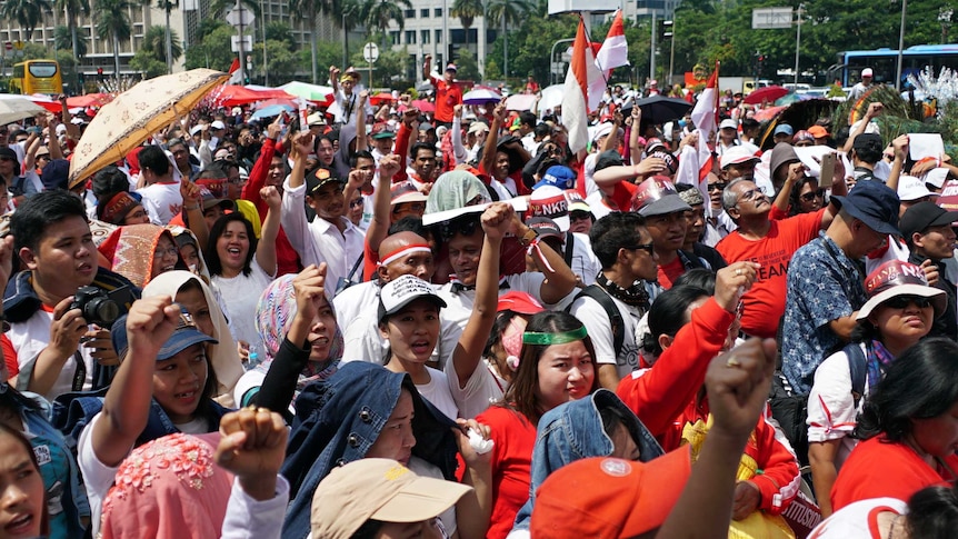 Indonesians attend a unity march