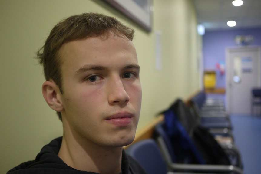 Close-up portrait of a young man looking sad