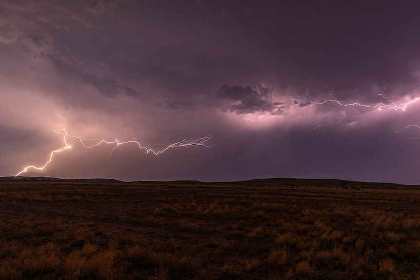 A lightning landscape across a rural backdrop