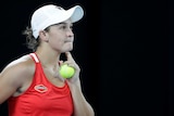 Ashleigh Barty looks up at the screen to watch a replay of a point on Rod Laver Arena at the Australian Open.