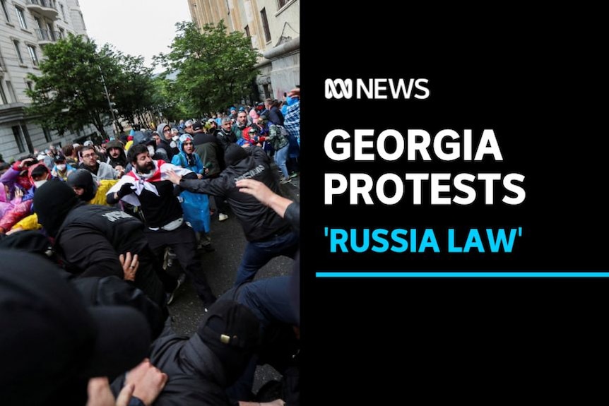 Georgia Protests, 'Russia Law': Protesters clash with police on a city street.
