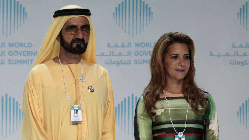 Dubai's ruler Mohammed bin Rashid al-Maktoum and his wife Princess Haya bint al-Hussein stand awkwardly next to each other