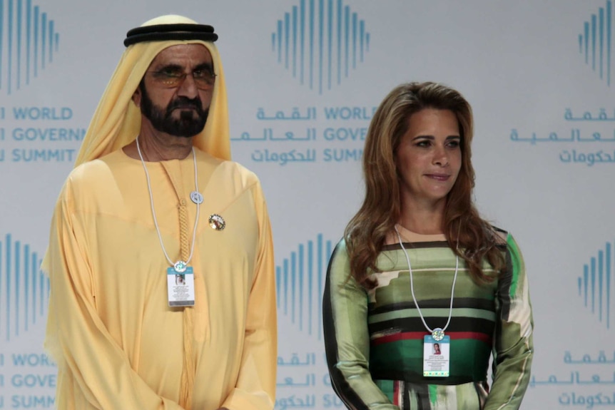 Dubai's ruler Mohammed bin Rashid al-Maktoum and his wife Princess Haya bint al-Hussein stand awkwardly next to each other