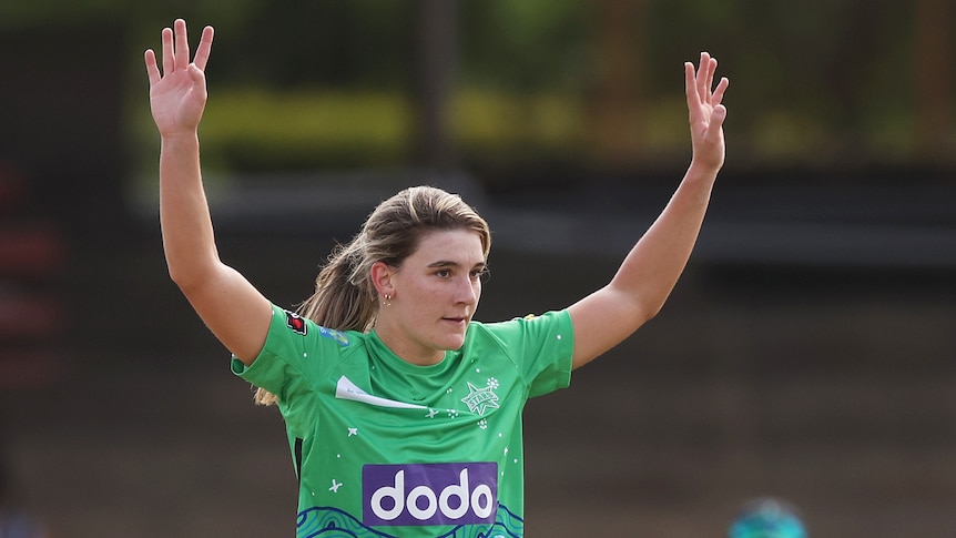 Annabel Sutherland raises her arms as she celebrates taking a wicket in the WBBL.