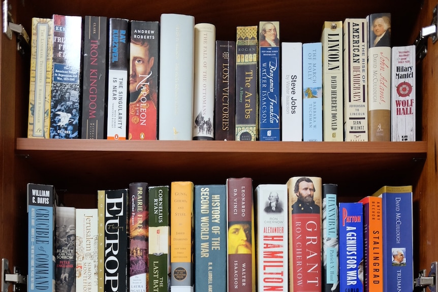 Bobby Zo's bookshelf displaying numerous English language titles.