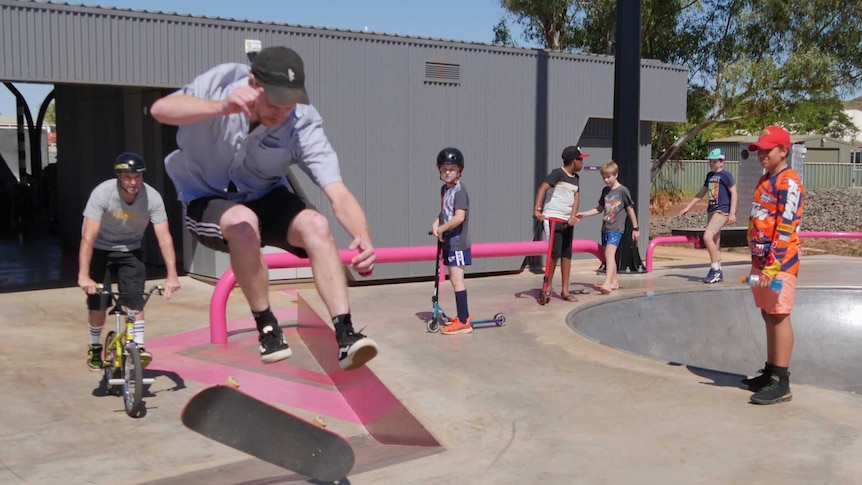 Young skateboarders, cyclists and scooter-riders.