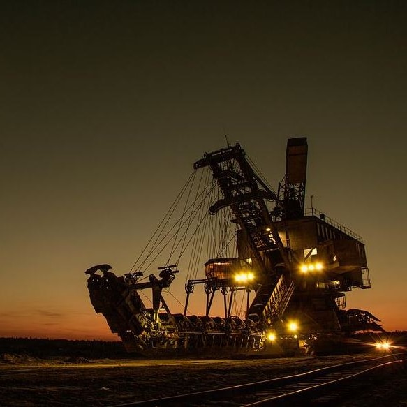 Picture of large mining machinery at night   