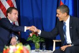 Barack Obama and Dmitry Medvedev shake hands