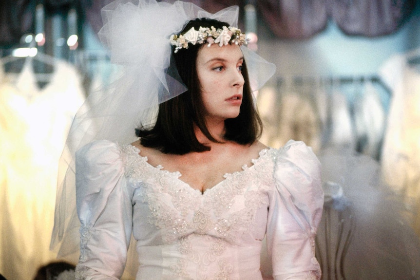 Muriel's Wedding - Toni Collette as Muriel trying on a wedding dress  by Robert McFarlane