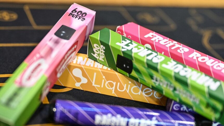 Brightly coloured vape packaging in France.