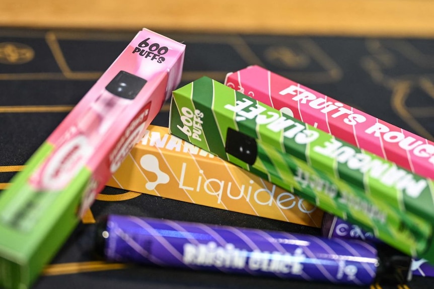 Brightly coloured vape packaging in France.