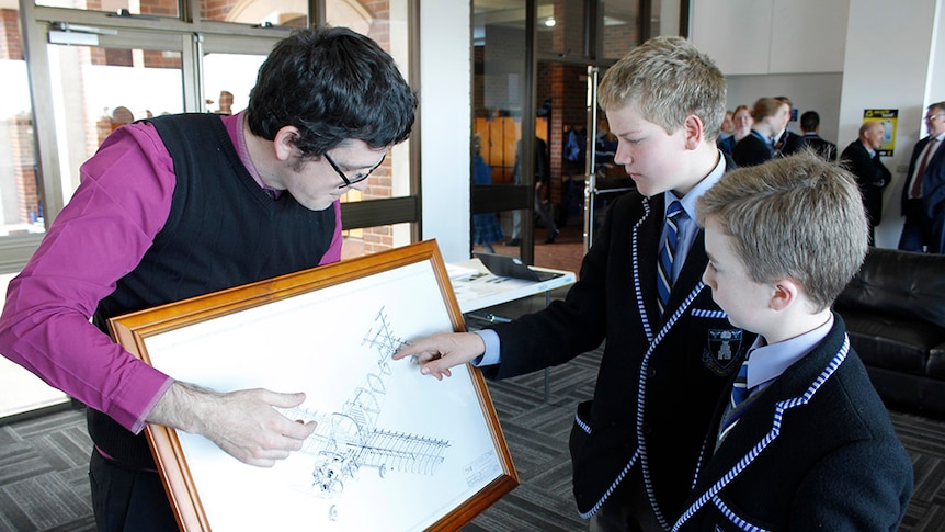 Teacher shows diagram of a plane