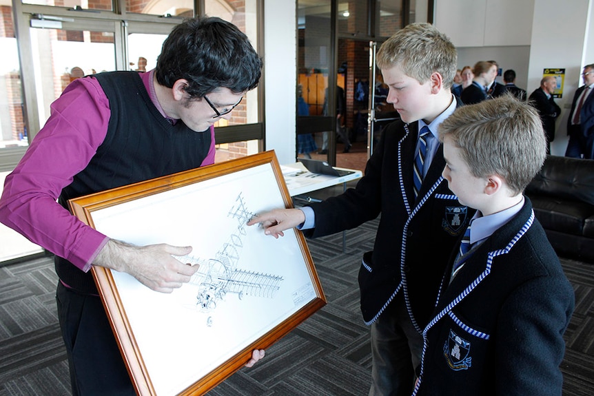 Teacher shows diagram of a plane