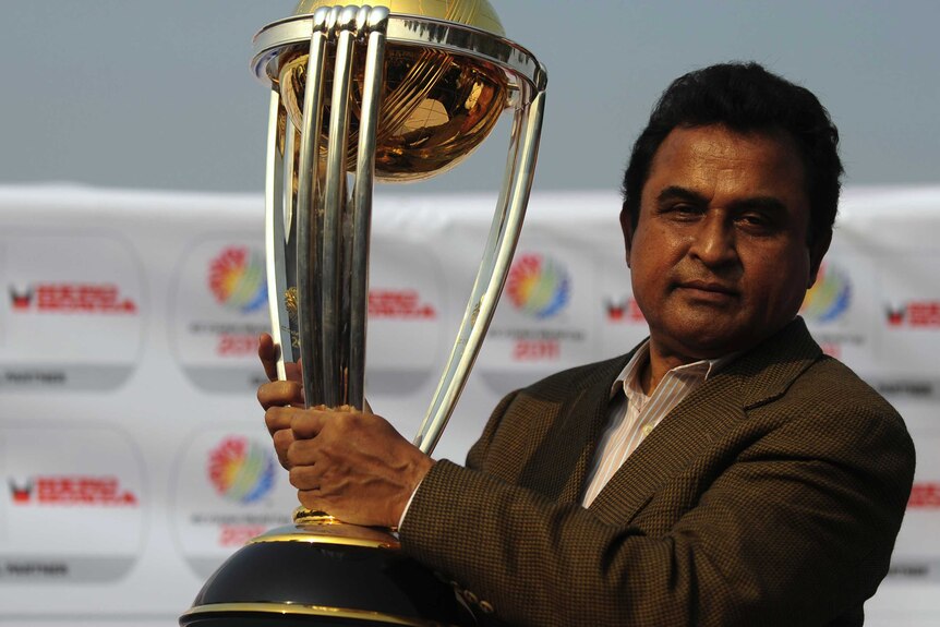 Mustafa Kamal with the Cricket World Cup trophy
