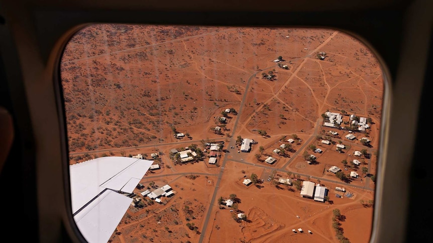 The community of Docker River is seen from the window of an airplane.